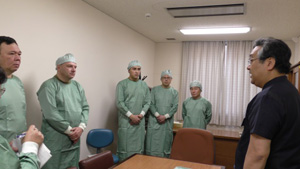 Kazakhstan military members receive a briefing from a professor at the National Defense Medical College.