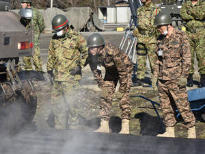 Mongolian personnel watching construction