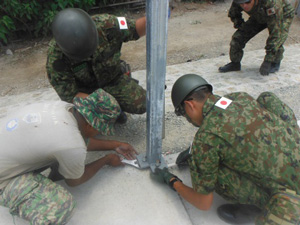 Fixing the building frame into position