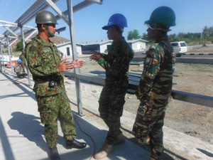 A Timor-Leste graduate of the Japan National Defense Academy assists with translation