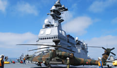 AH-64D helicopter boarding a MSDF destroyer in support of island landing operations