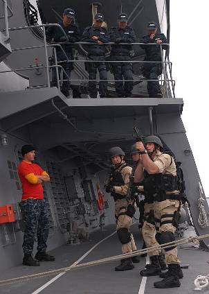 The visit, board, search and seizure team assigned to USS Chosin (CG 65) look for possible threats upon boarding JS Atago (DDG 117).
